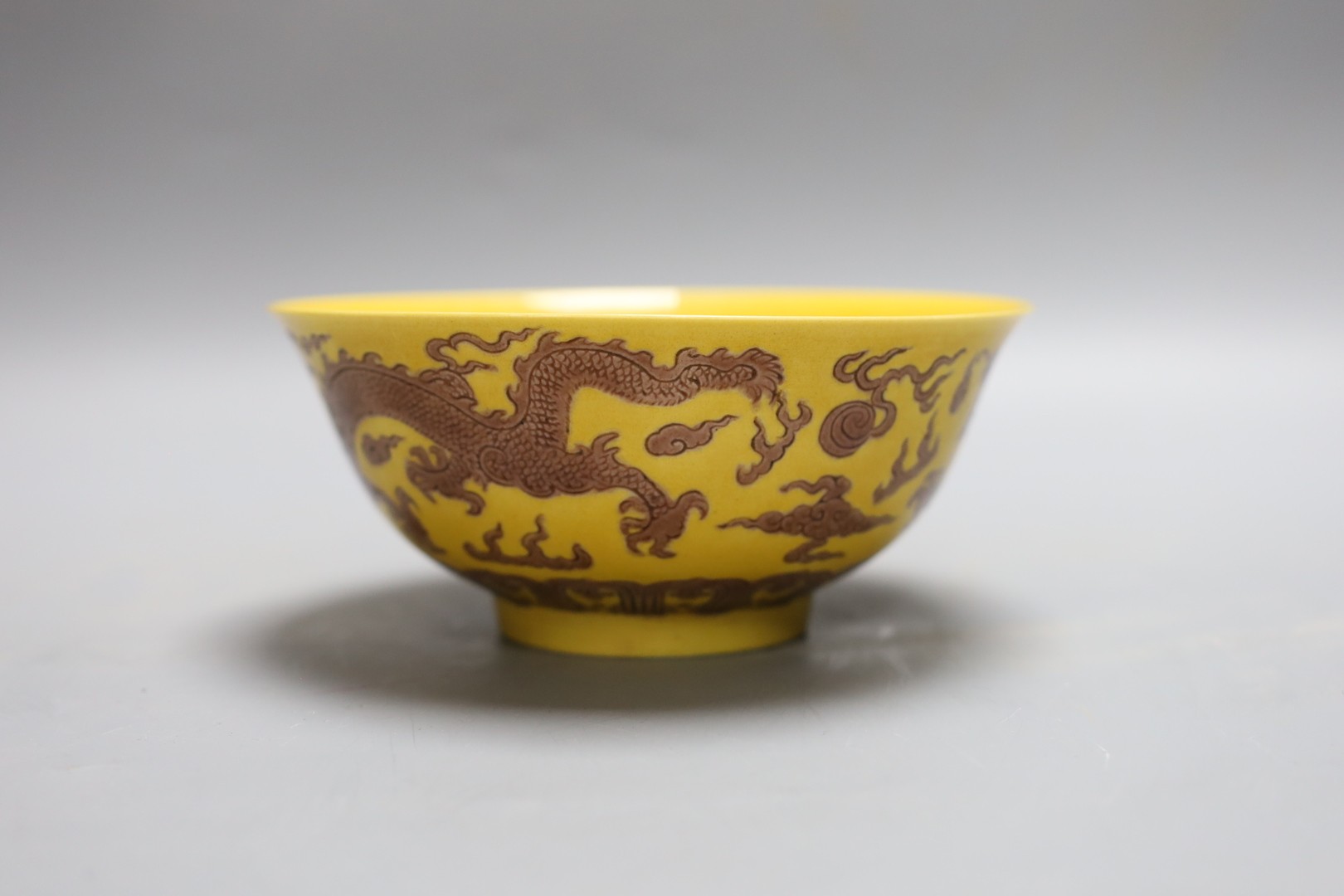 A Chinese yellow ground 'dragon' bowl, 15cm diameter